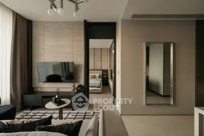 Modern living room with stylish decor and wall-mounted TV