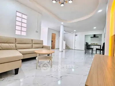 Spacious modern living room with elegant marble flooring and stylish furniture