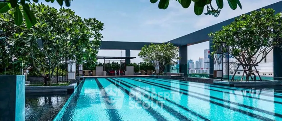 Luxurious rooftop pool with city skyline view and lush greenery