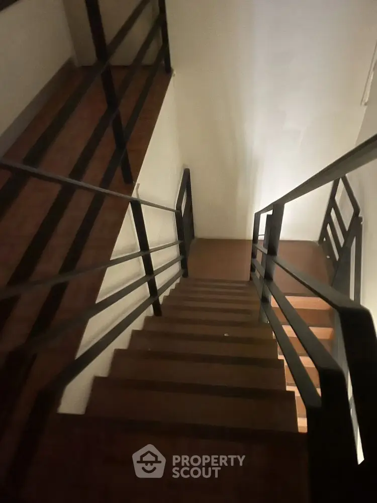 Modern staircase with sleek black railings in a contemporary home