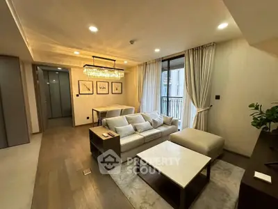 Luxurious living room with elegant lighting and balcony access in modern apartment.