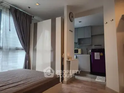 Cozy studio apartment with modern kitchen and stylish decor