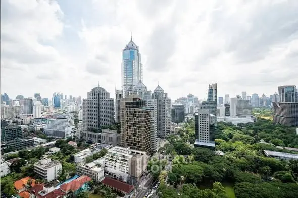 Stunning cityscape view showcasing modern skyscrapers and lush greenery in a vibrant urban setting.