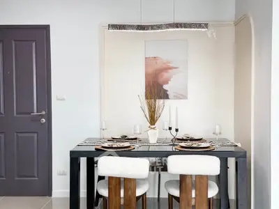 Modern dining area with elegant table setting and stylish decor
