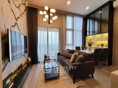 Luxurious modern living room with elegant decor and large windows offering stunning city views.
