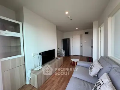 Modern living room with sleek furniture and wooden flooring