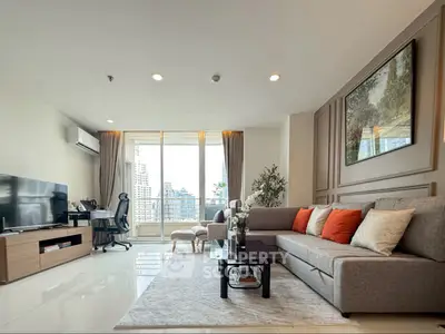 Spacious modern living room with city view and stylish decor