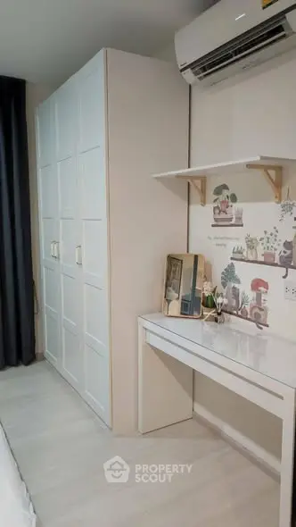 Modern bedroom with stylish wardrobe and air conditioning unit