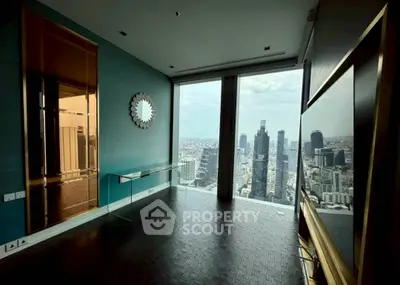 Luxurious high-rise apartment with stunning city skyline view and modern interior design.