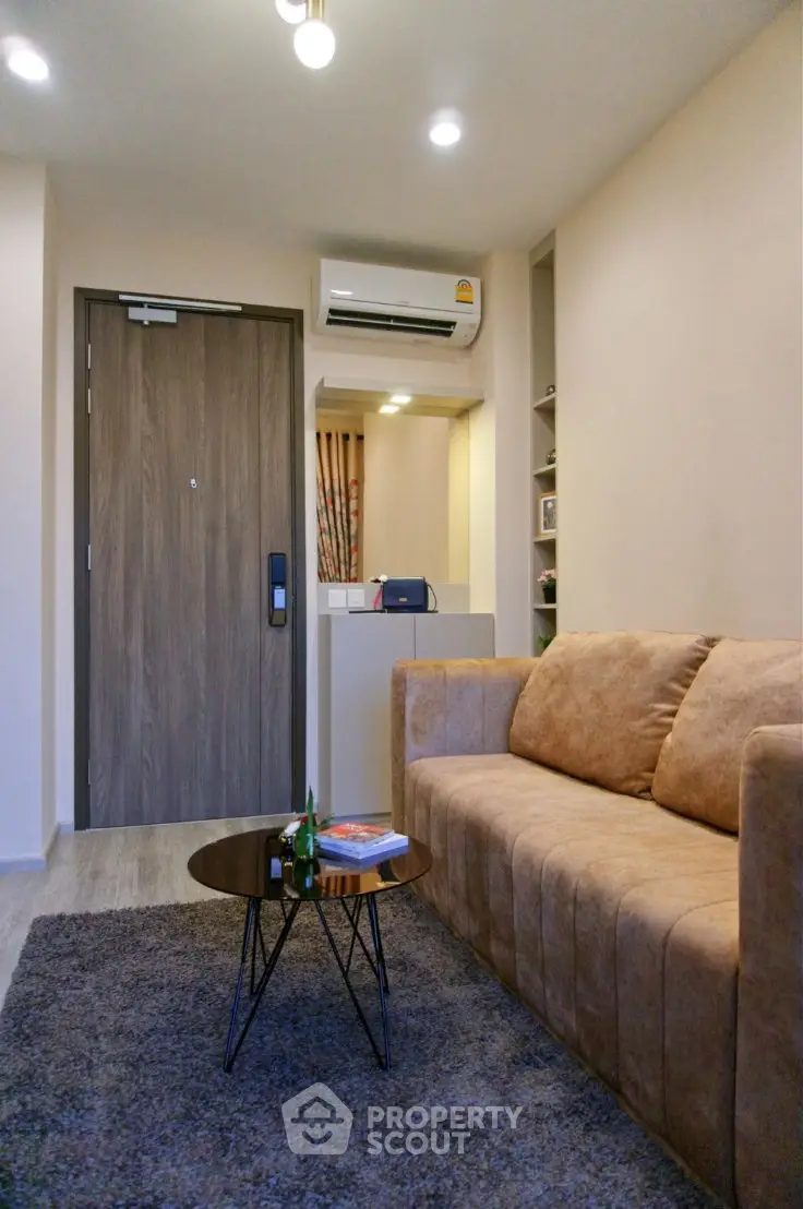 Cozy living room with modern sofa and stylish decor in a contemporary apartment.