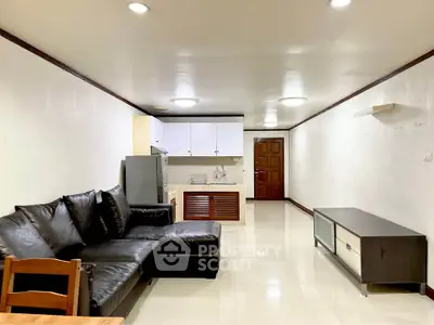 Spacious living room with modern kitchen in open layout apartment
