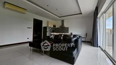 Spacious modern living room with open kitchen and large windows