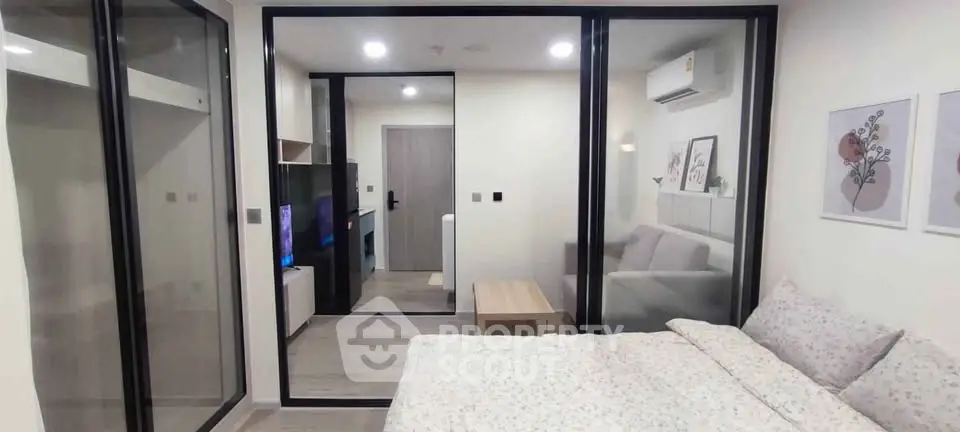 Modern bedroom with sliding glass doors and stylish decor