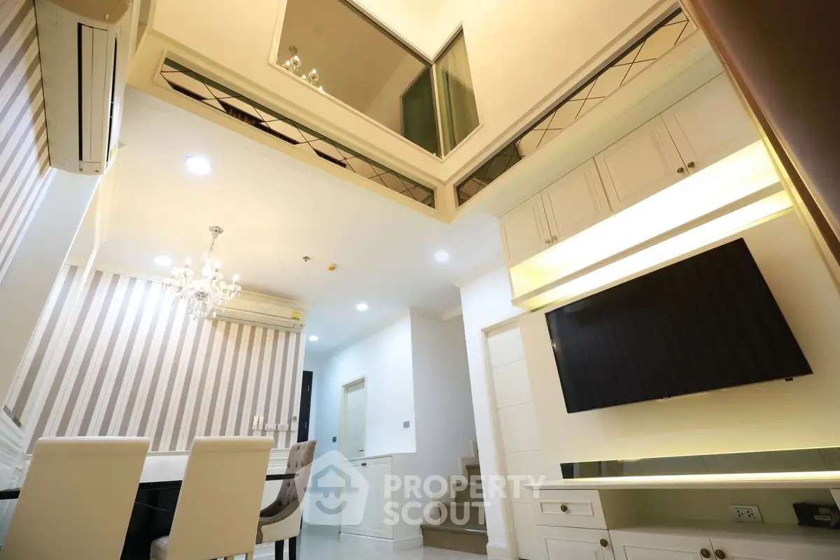 Luxurious modern living room with high ceiling and elegant decor