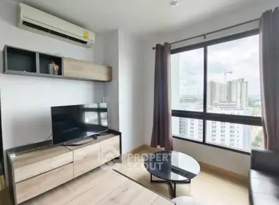 Modern living room with city view, stylish furniture, and natural light
