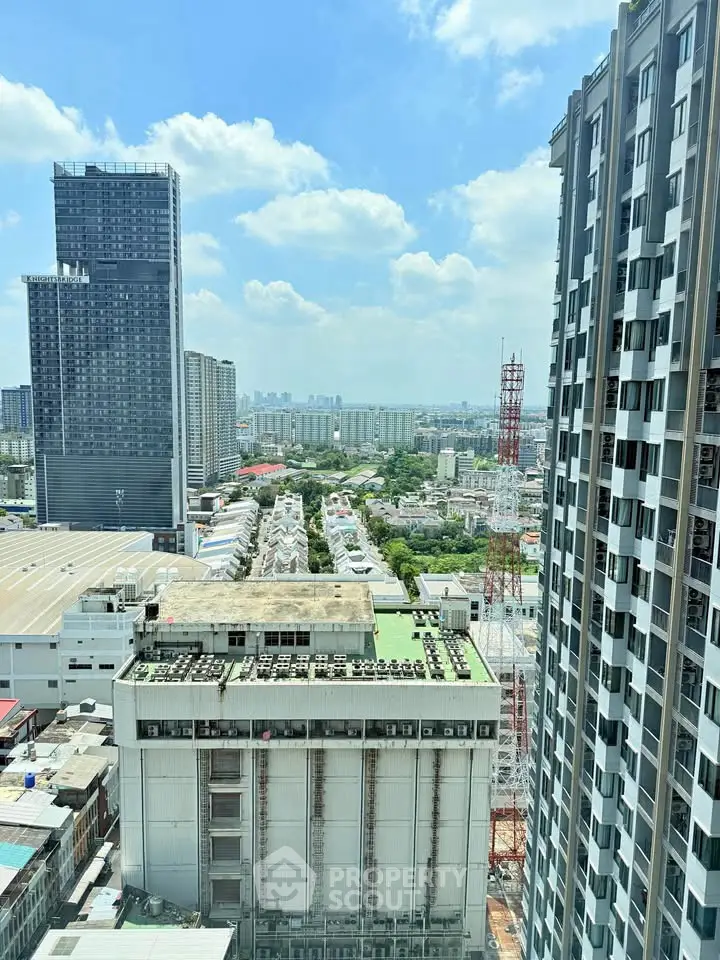 Stunning cityscape view from high-rise building with clear blue sky