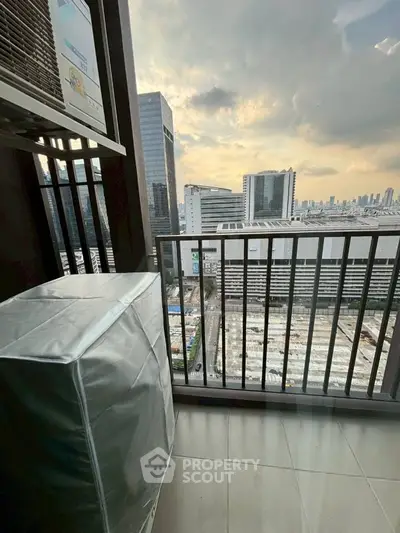 Stunning city view from high-rise balcony with modern urban skyline.