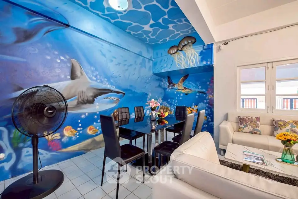 Vibrant ocean-themed living room with stunning wall art and modern furniture
