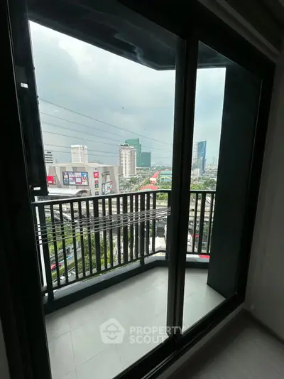 Modern apartment balcony with city skyline view, perfect for urban living.