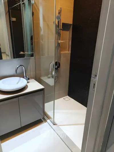 Modern bathroom with sleek shower and stylish sink vanity