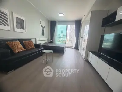 Modern studio apartment with sleek design and city view, featuring a cozy living area and stylish decor.