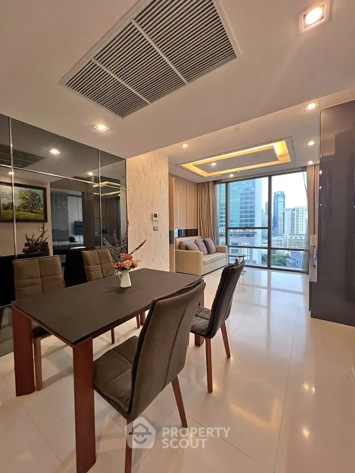 Luxurious modern living room with city view, elegant dining area, and stylish decor in high-rise apartment.