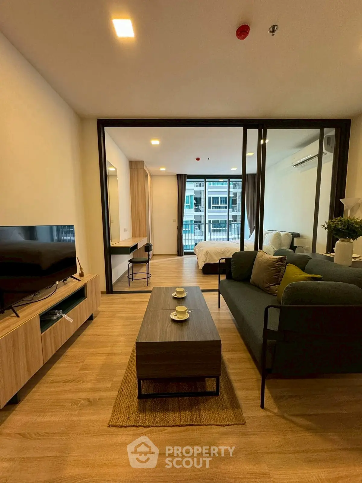 Modern living room with open layout and stylish decor in a contemporary apartment.