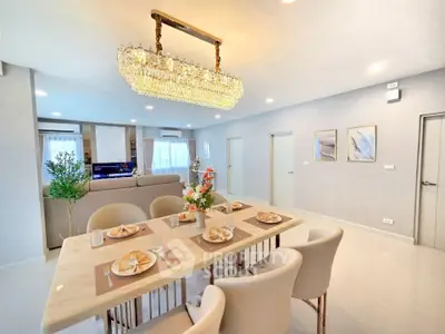 Luxurious dining area with elegant chandelier and modern decor