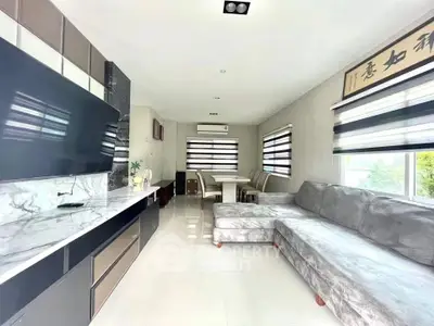 Modern living room with sleek design and large sectional sofa