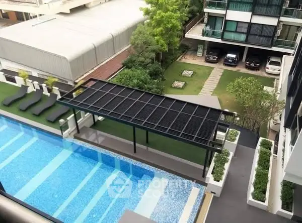 Luxurious apartment complex with stunning pool and garden view