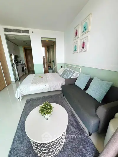 Modern studio apartment with cozy living area and stylish decor