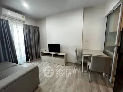 Modern living room with sleek furniture and natural light, perfect for cozy living.