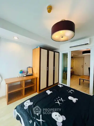 Modern bedroom with stylish decor and ample storage space