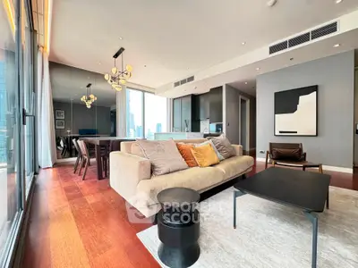 Luxurious modern living room with city view, elegant decor, and spacious layout in high-rise apartment.