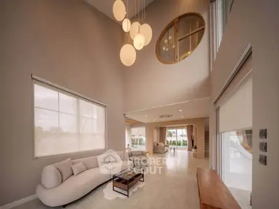 Luxurious modern living room with high ceilings and elegant lighting