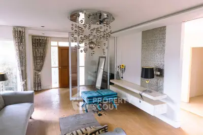 Stylish living room with modern chandelier and elegant decor