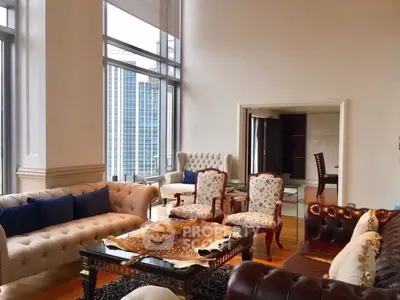 Luxurious living room with elegant furniture and stunning city view, perfect for sophisticated urban living.