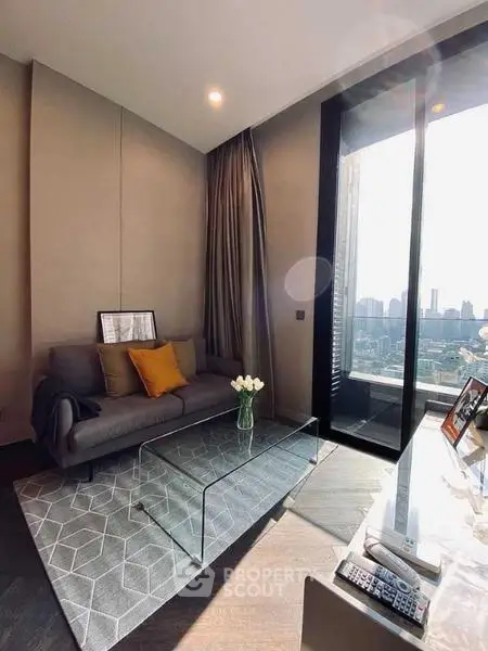 Modern living room with city view, stylish decor, and natural light.
