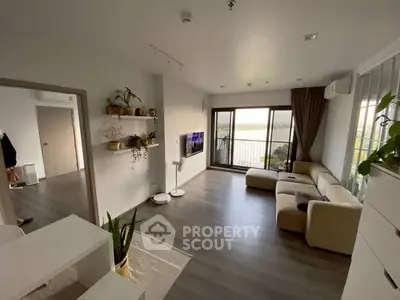 Spacious modern living room with large windows and stunning view