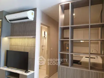Modern apartment interior with air conditioning and stylish shelving