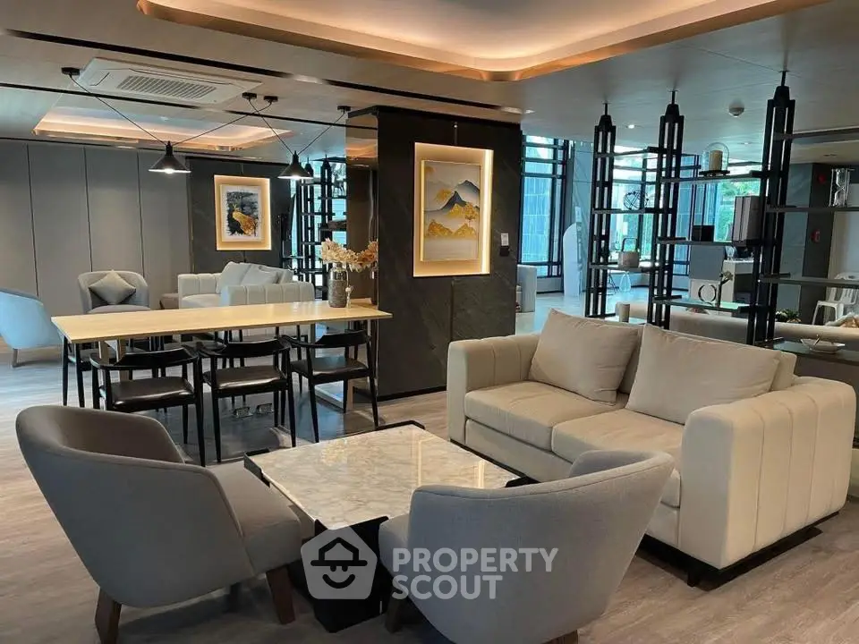 Luxurious modern living room with elegant furniture and stylish decor in a spacious open layout.