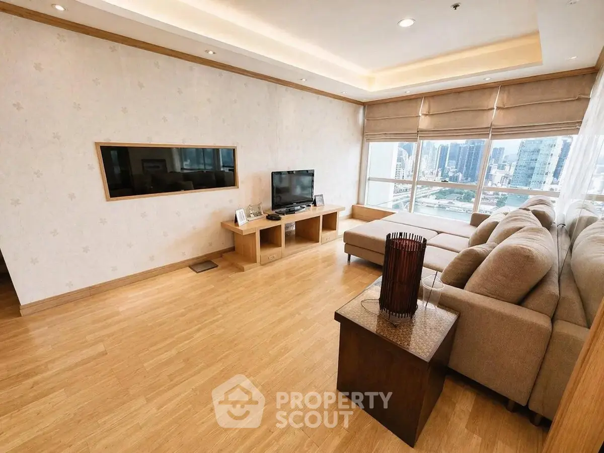 Spacious living room with city view and modern furnishings