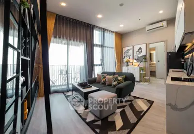 Modern living room with stylish decor and balcony view in a contemporary apartment.