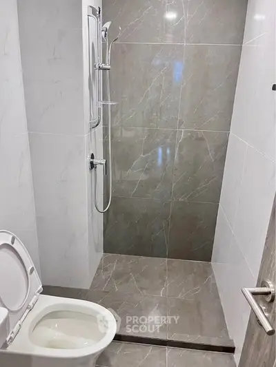Modern bathroom with sleek shower and elegant tile design