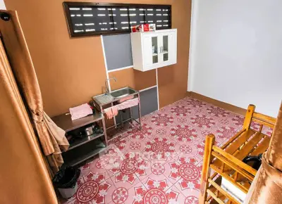 Charming kitchen with unique patterned flooring and wooden accents, perfect for cozy home living.
