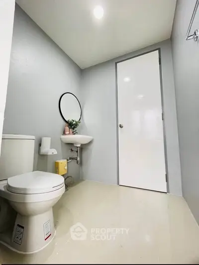 Modern minimalist bathroom with sleek fixtures and neutral tones