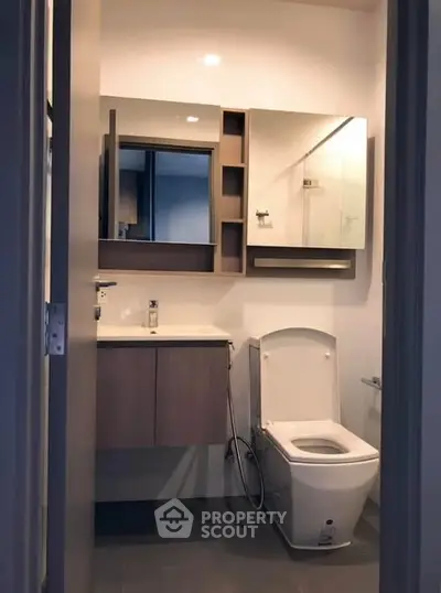 Modern bathroom with sleek fixtures and ample storage space