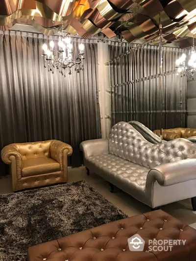 Luxurious living room with reflective ceiling and elegant chandeliers, featuring plush leather sofas and rich drapery, perfect for upscale living.