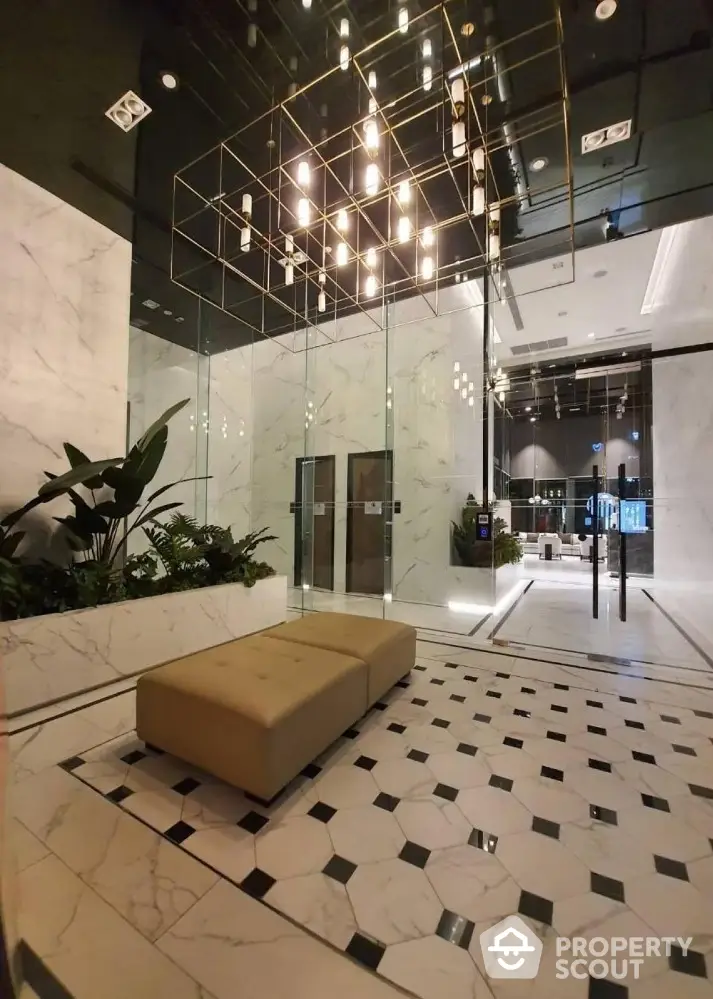 Luxurious modern building entrance with elegant lighting and marble flooring