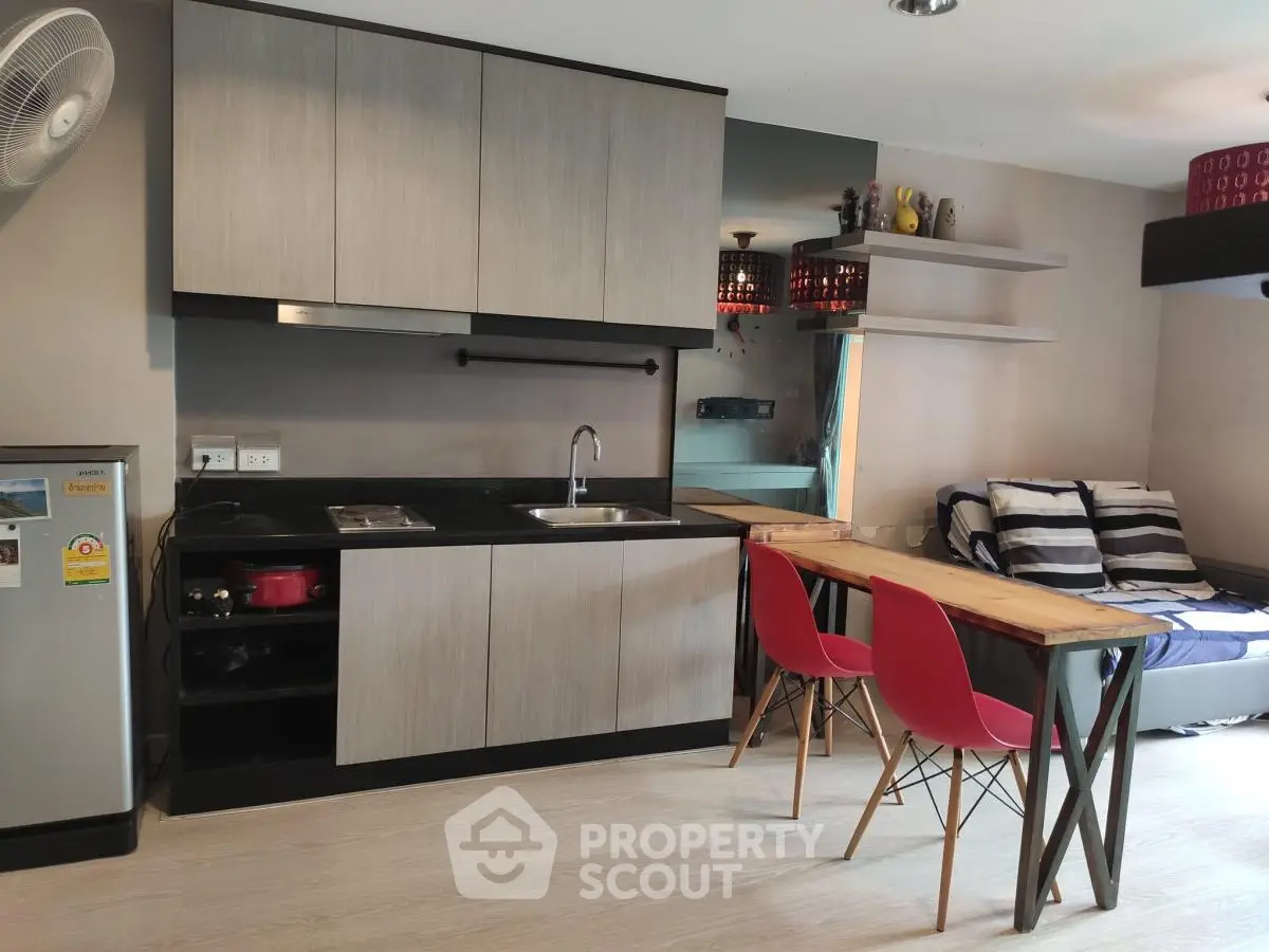 Modern compact kitchen with dining area and cozy living space